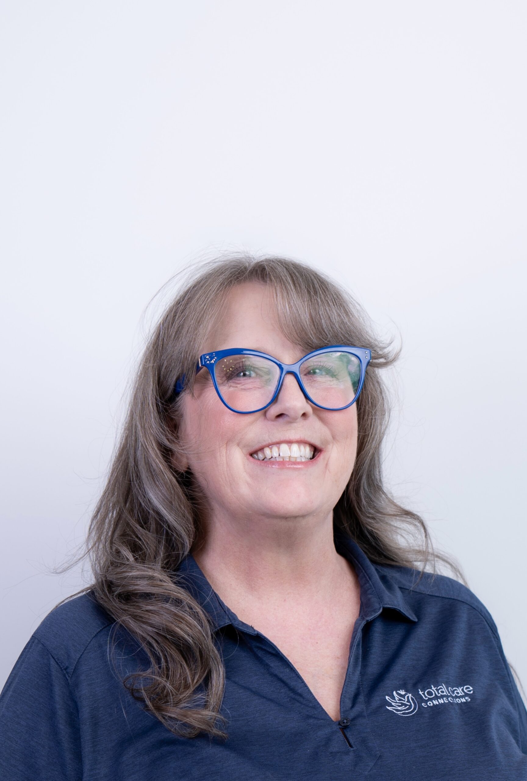 Suzanne Tabbert, Manager at Total Care Connections in Tucson, smiling at the camera.