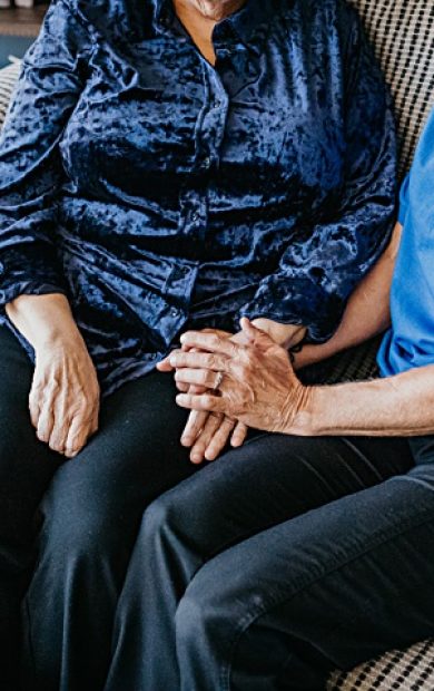 caregiver-client-holding-hands